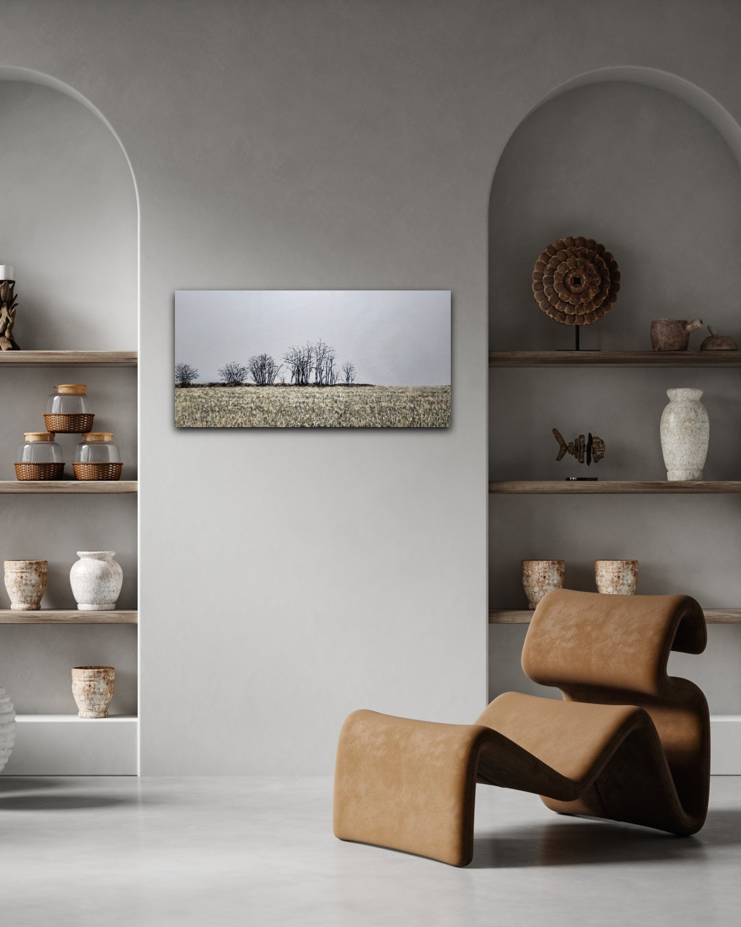 Finter 18"x36" oil painting of a field with winter trees and a blue-grey horizon staged on a grey wall