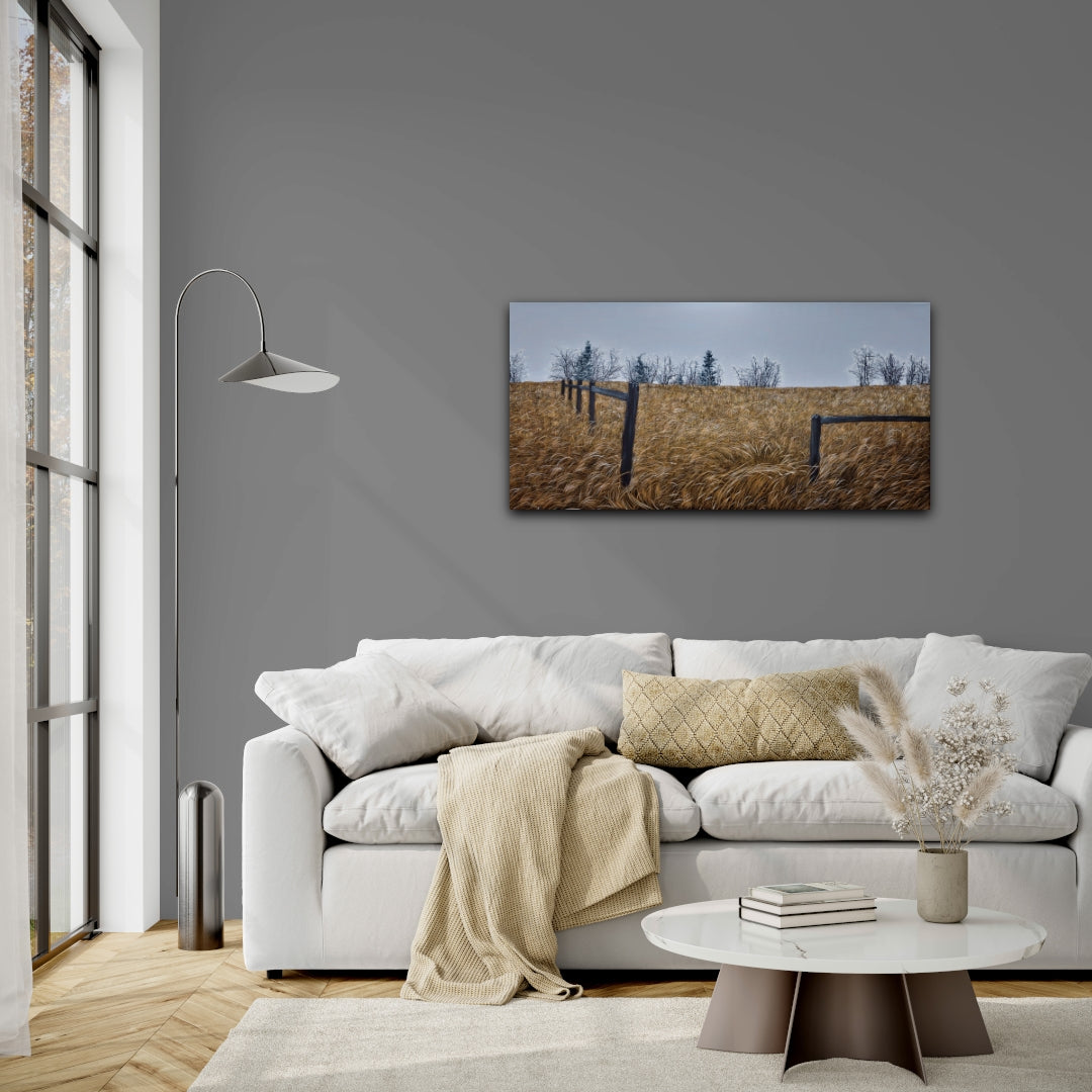 Living room with a gray wall, white sofa, and a painting of a field.