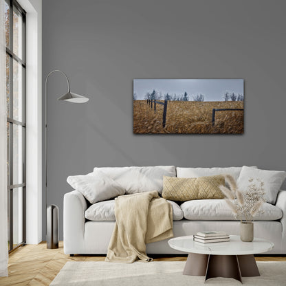 Living room with a gray wall, white sofa, and a painting of a field.