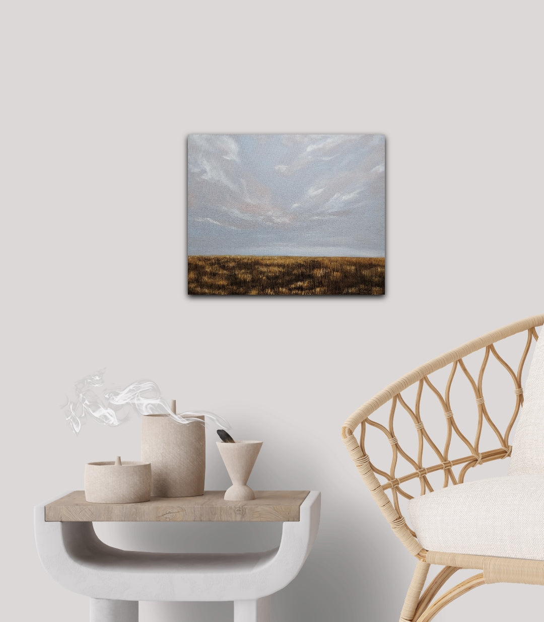 Breathe oil landscape painting of a soft sky and flat prairie in fall all gold and brown, on a white wall