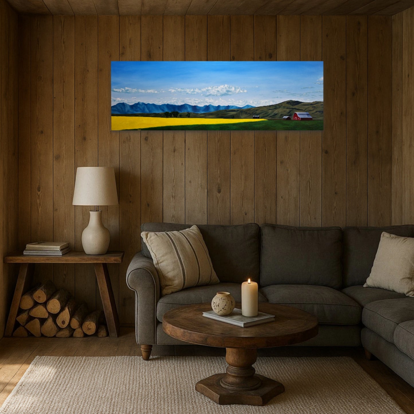 Living room with a large wall art of a mountain landscape above a sofa.