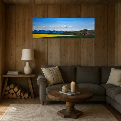 Living room with a large wall art of a mountain landscape above a sofa.