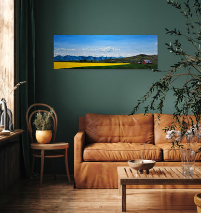 Living room with a brown leather sofa, wooden coffee table, and a large wall-mounted painting of a landscape.