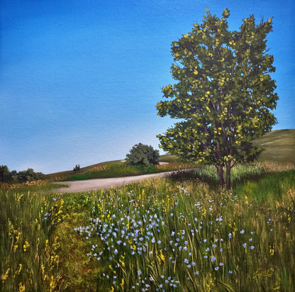 Landscape painting of a tree in a field with flowers and a clear blue sky.
