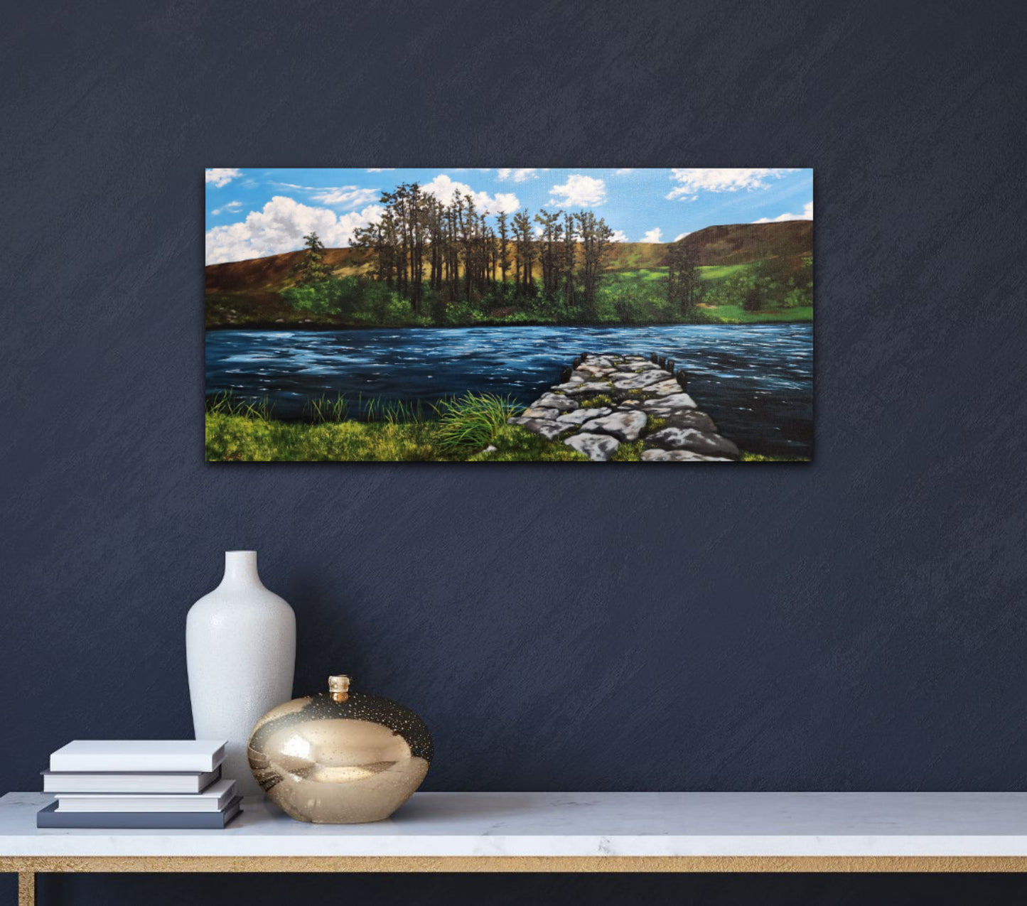 Oil_painting_of_a_stone_dock_leading_to_a_lake_framed_with_large_trees_rolling_hills_grass_and_reeds on a blue wall
