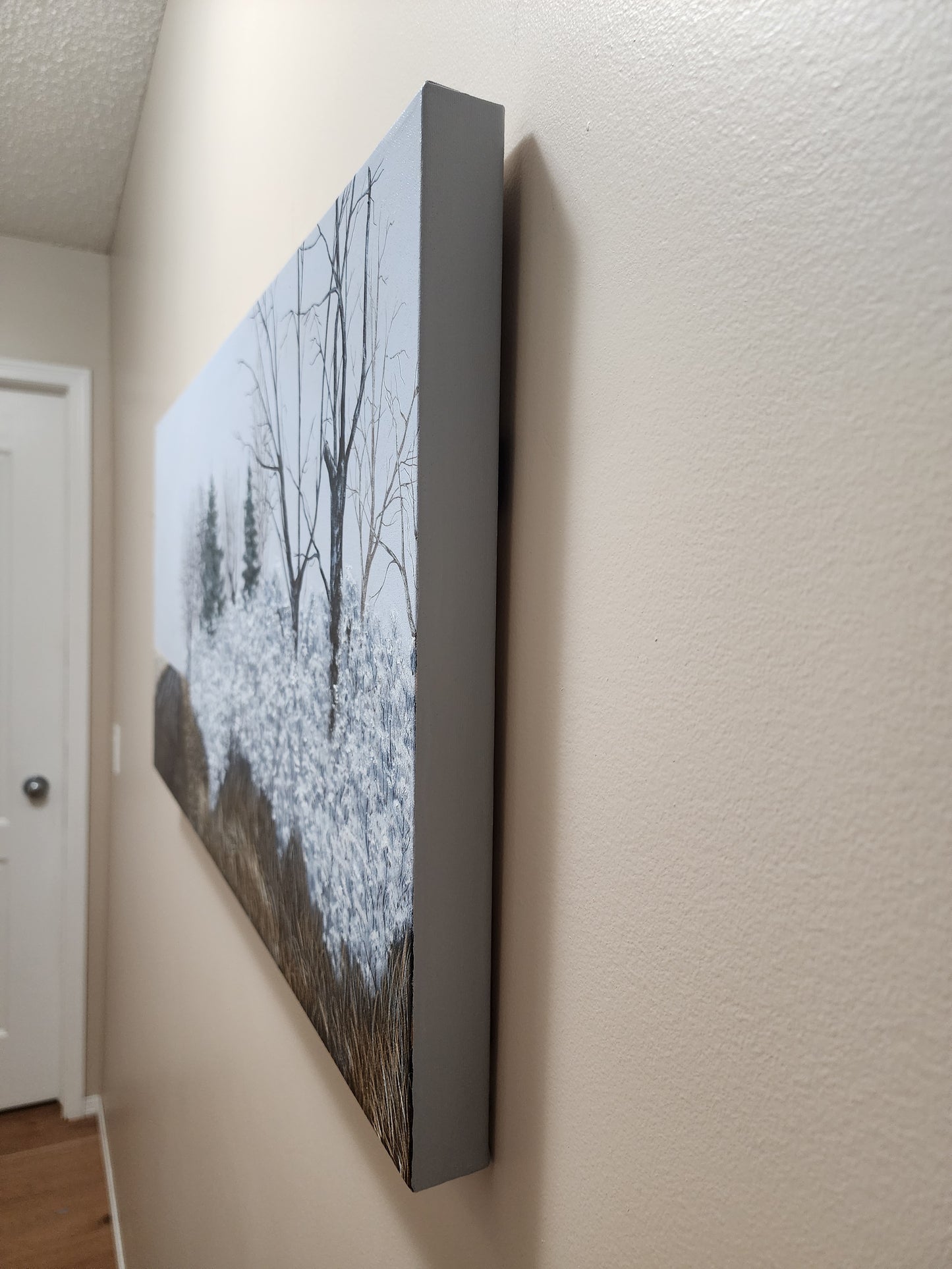 Framed artwork on a wall - finished in gentle grey