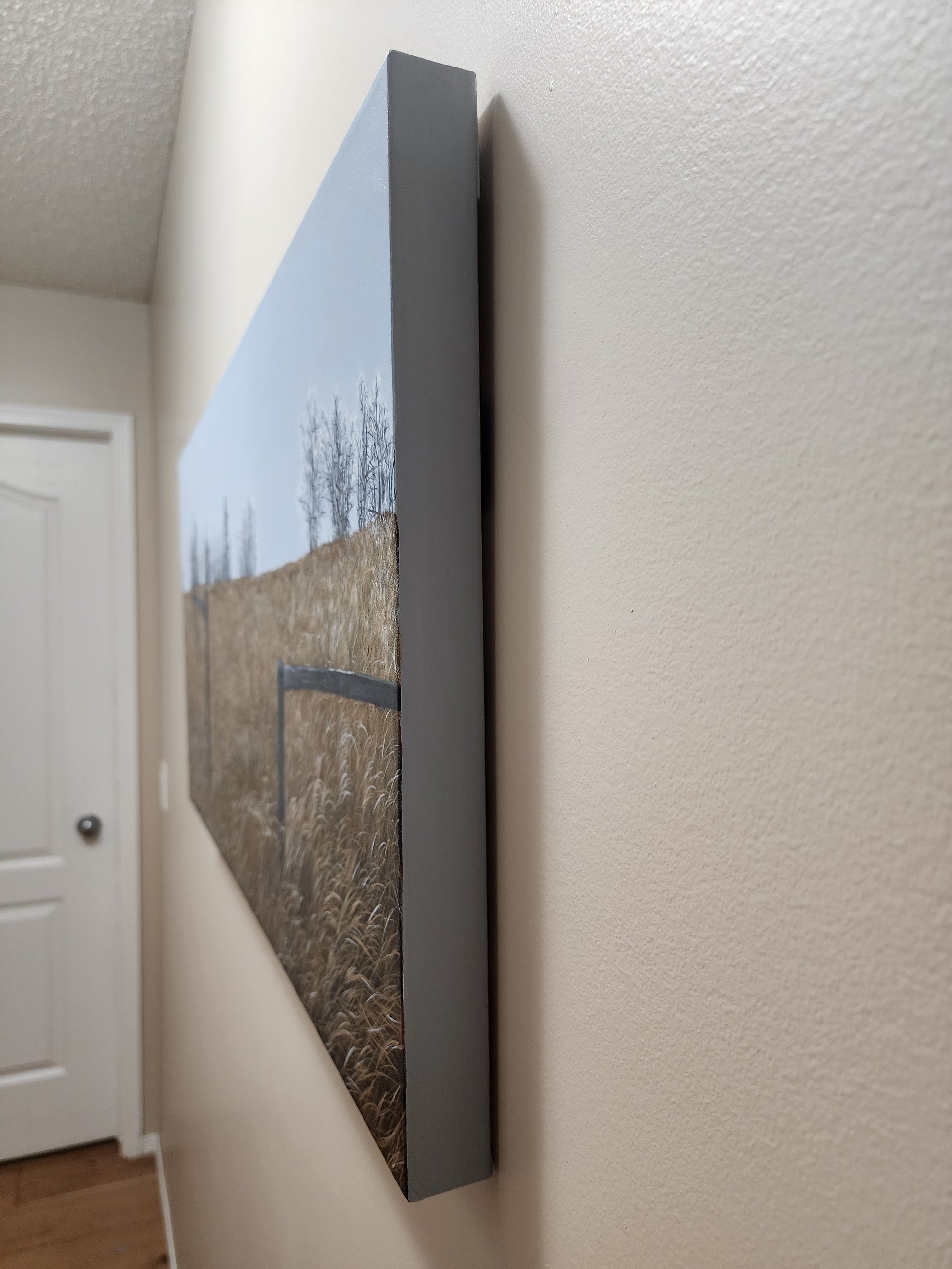 Side of oil landscape painting finished in gentle grey